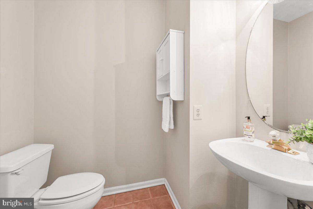 12664 Granite Ridge Drive North Potomac, MD 20878 - Photo 6 of 37 a bathroom with a sink a toilet and a mirror