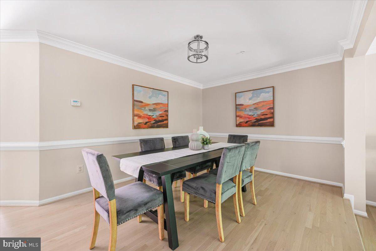 12664 Granite Ridge Drive North Potomac, MD 20878 - Photo 7 of 37 a view of a dining room with furniture
