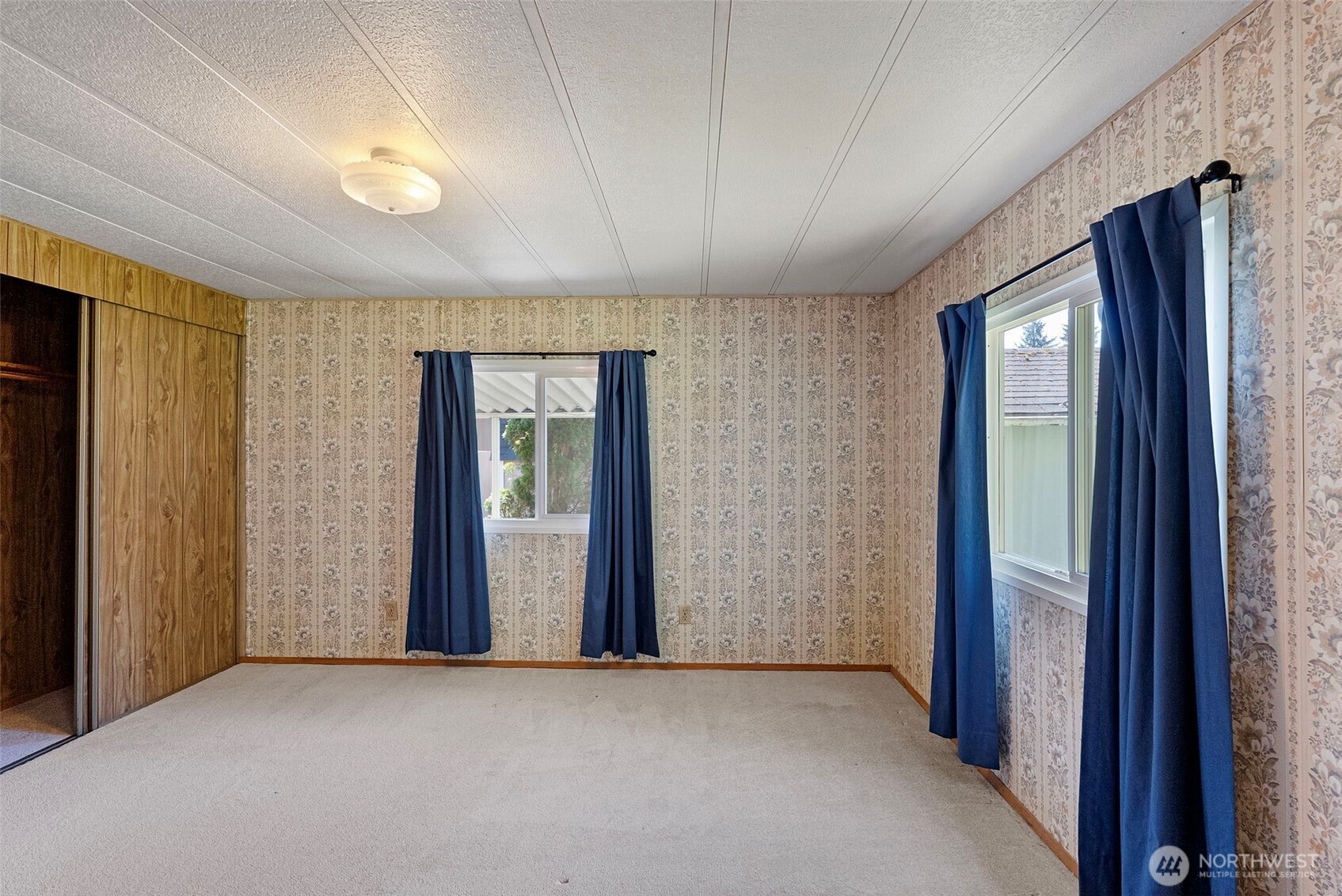 2200 196th Street Southeast, Unit 43 Bothell, WA 98012 - Photo 11 of 31 an empty room with windows and closet