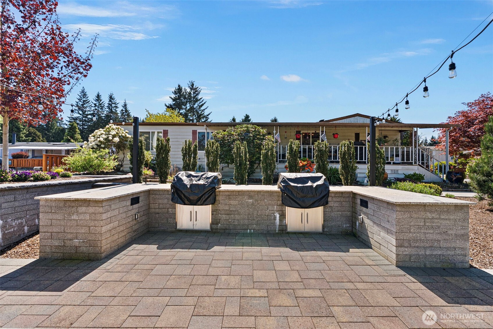 2200 196th Street Southeast, Unit 43 Bothell, WA 98012 - Photo 24 of 31 a view of a patio with a chairs and potted plants