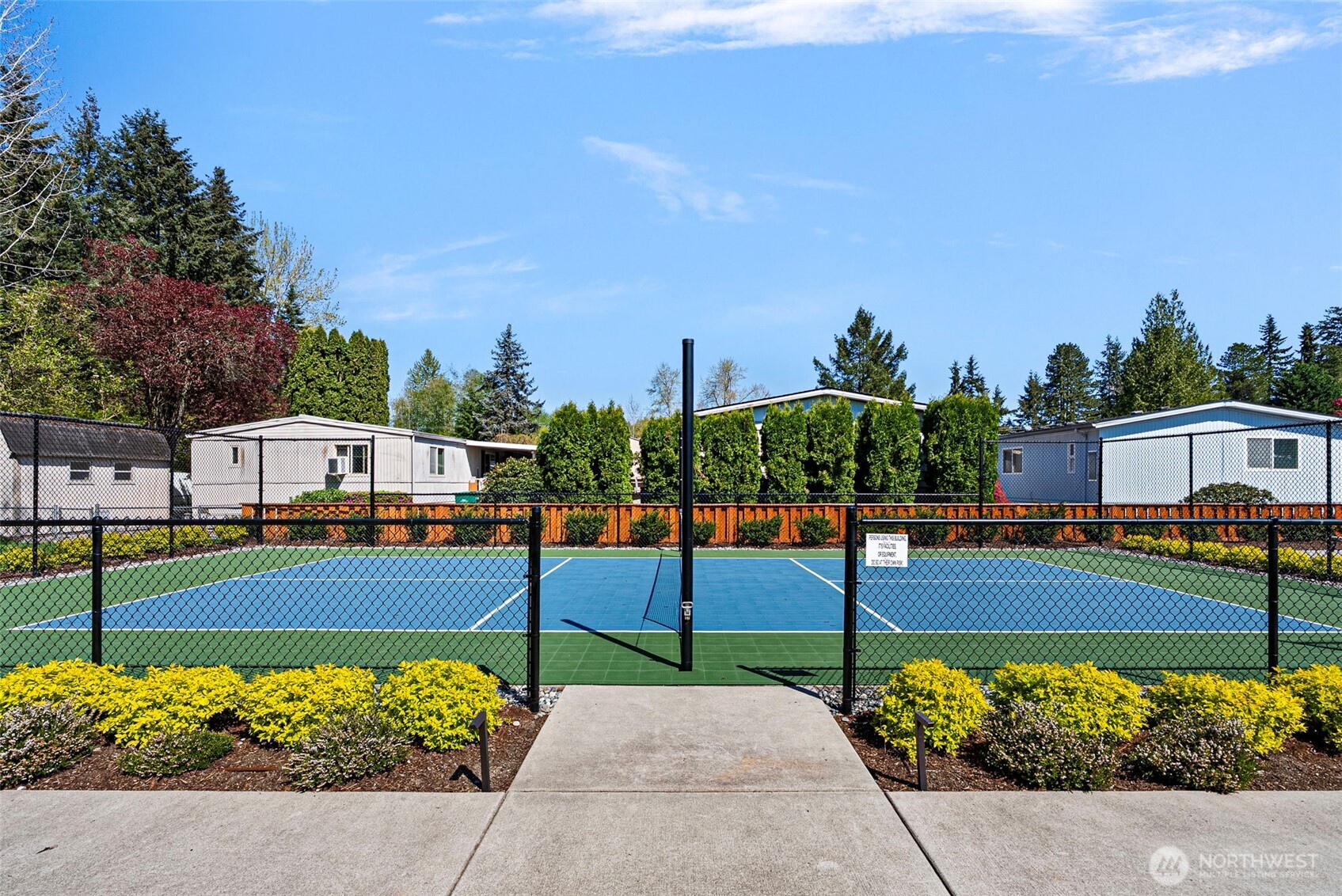 2200 196th Street Southeast, Unit 43 Bothell, WA 98012 - Photo 26 of 31 a view of a white house with a yard and potted plants