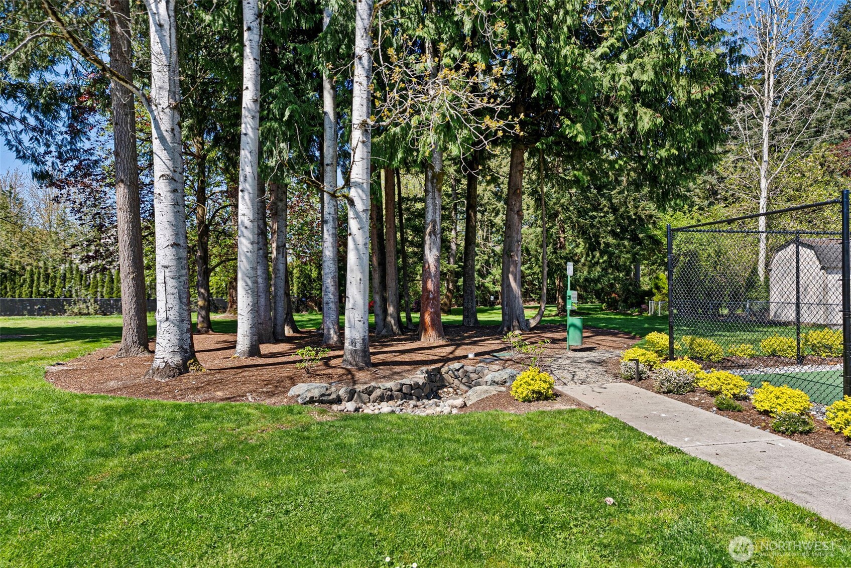 2200 196th Street Southeast, Unit 43 Bothell, WA 98012 - Photo 28 of 31 a view of a backyard with swimming pool