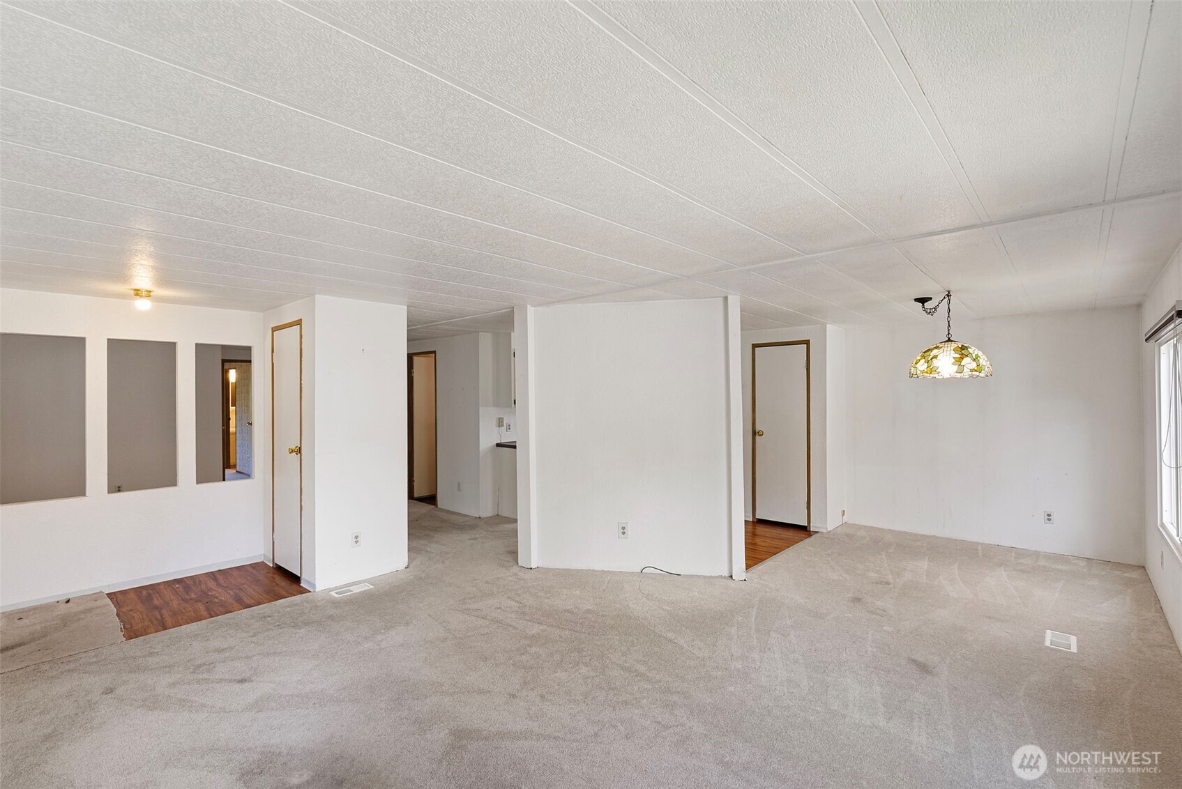 2200 196th Street Southeast, Unit 43 Bothell, WA 98012 - Photo 3 of 31 an empty room with window and wooden floor