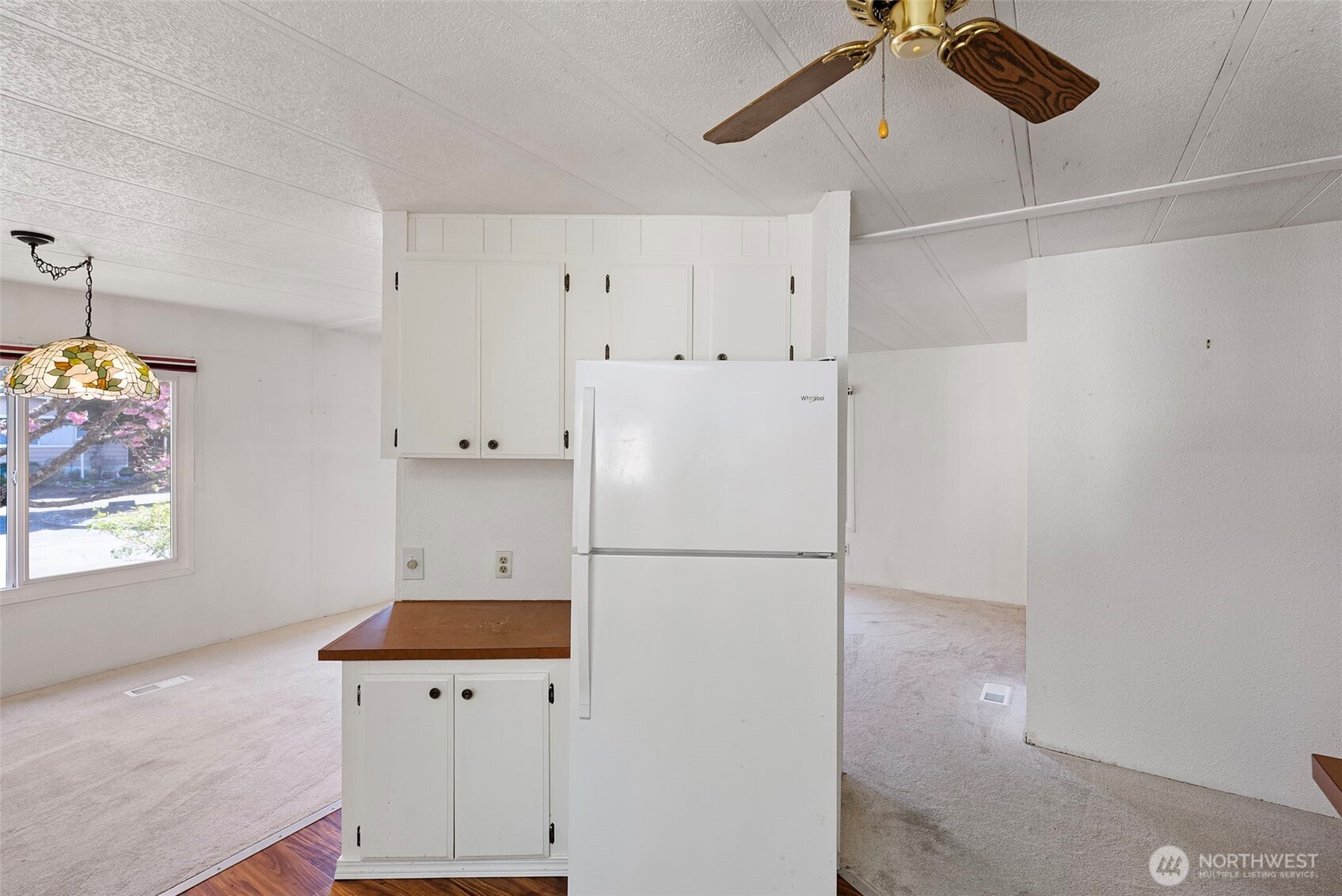 2200 196th Street Southeast, Unit 43 Bothell, WA 98012 - Photo 7 of 31 a white refrigerator freezer sitting inside of a kitchen