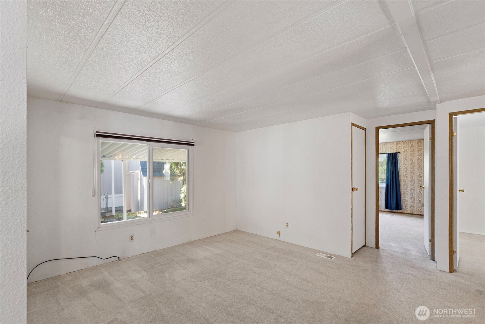 2200 196th Street Southeast, Unit 43 Bothell, WA 98012 - Photo 9 of 31 an empty room with mirror
