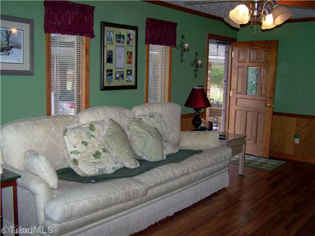 263 Salem Road Lexington, NC 27295 - Photo 3 of 10 Den/Family/Great Room. Beautiful Woodwork and Laminate Floors in Den/Family Rm