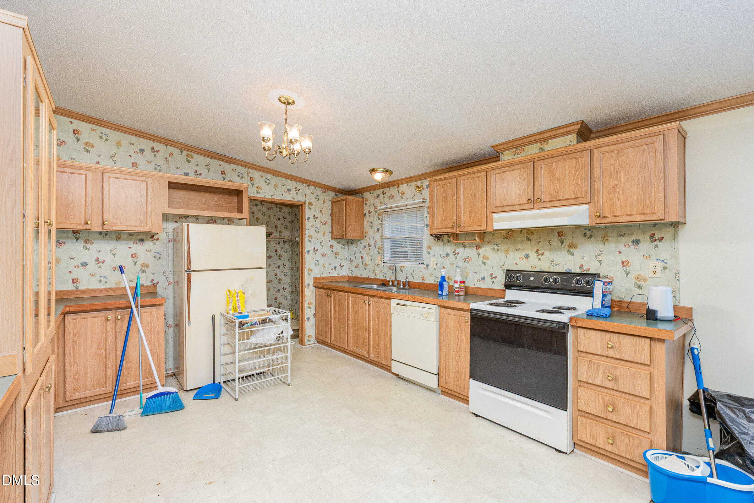 7472 Edwards Road Castalia, NC 27816 - Photo 11 of 36 a kitchen with stainless steel appliances granite countertop a stove a sink and a refrigerator