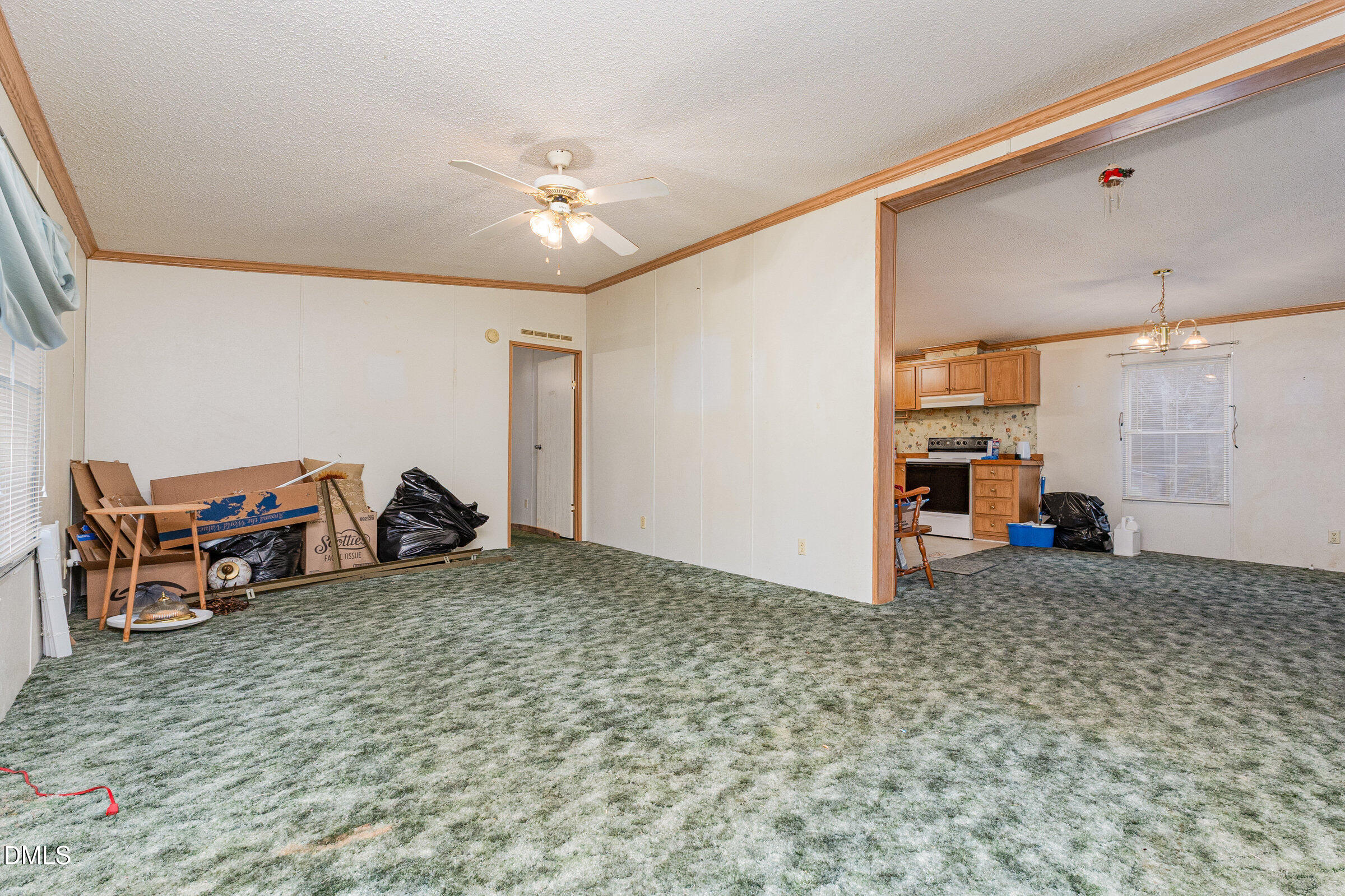 7472 Edwards Road Castalia, NC 27816 - Photo 12 of 36 a view of a livingroom with furniture and a garage