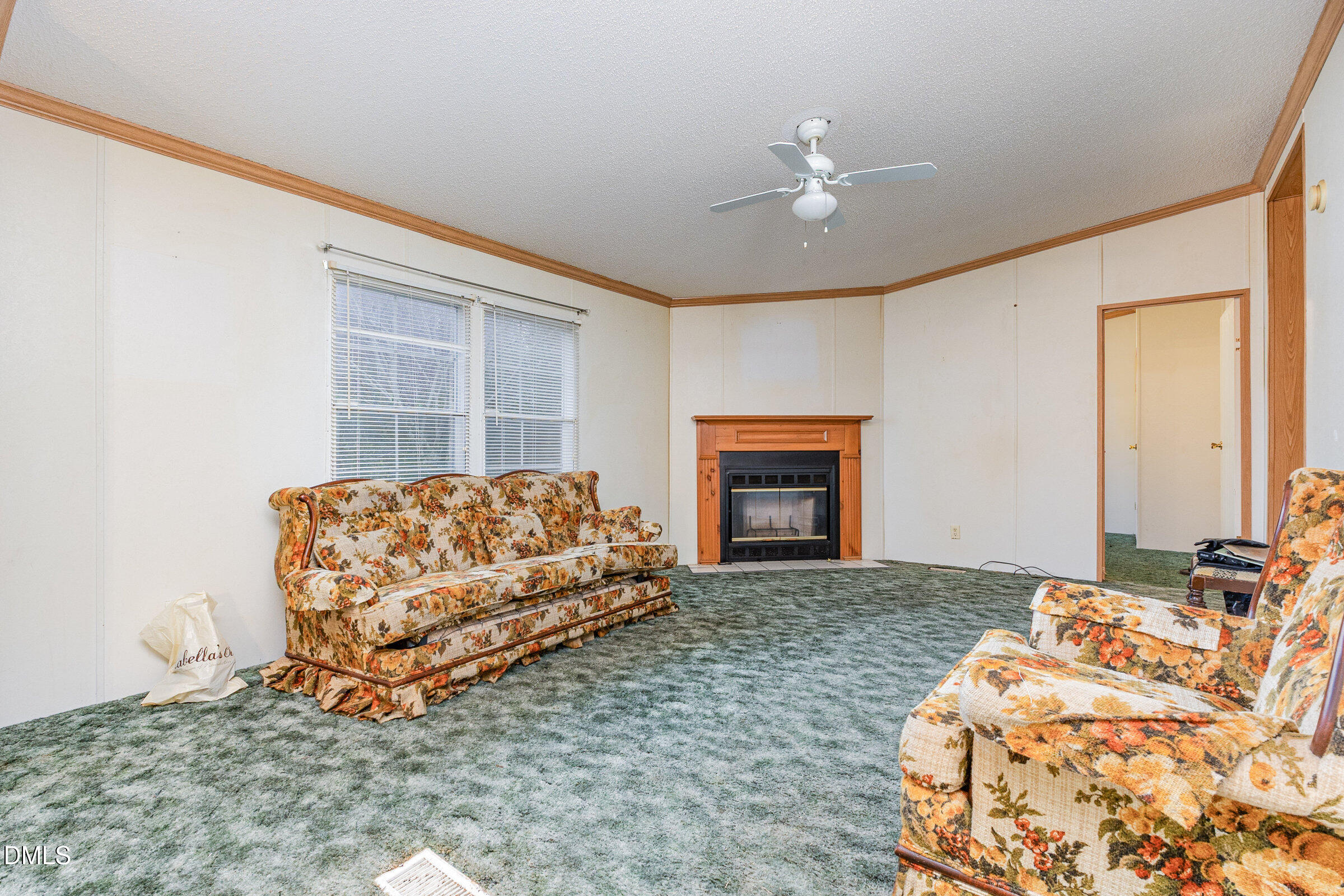 7472 Edwards Road Castalia, NC 27816 - Photo 13 of 36 a living room with furniture and a fireplace