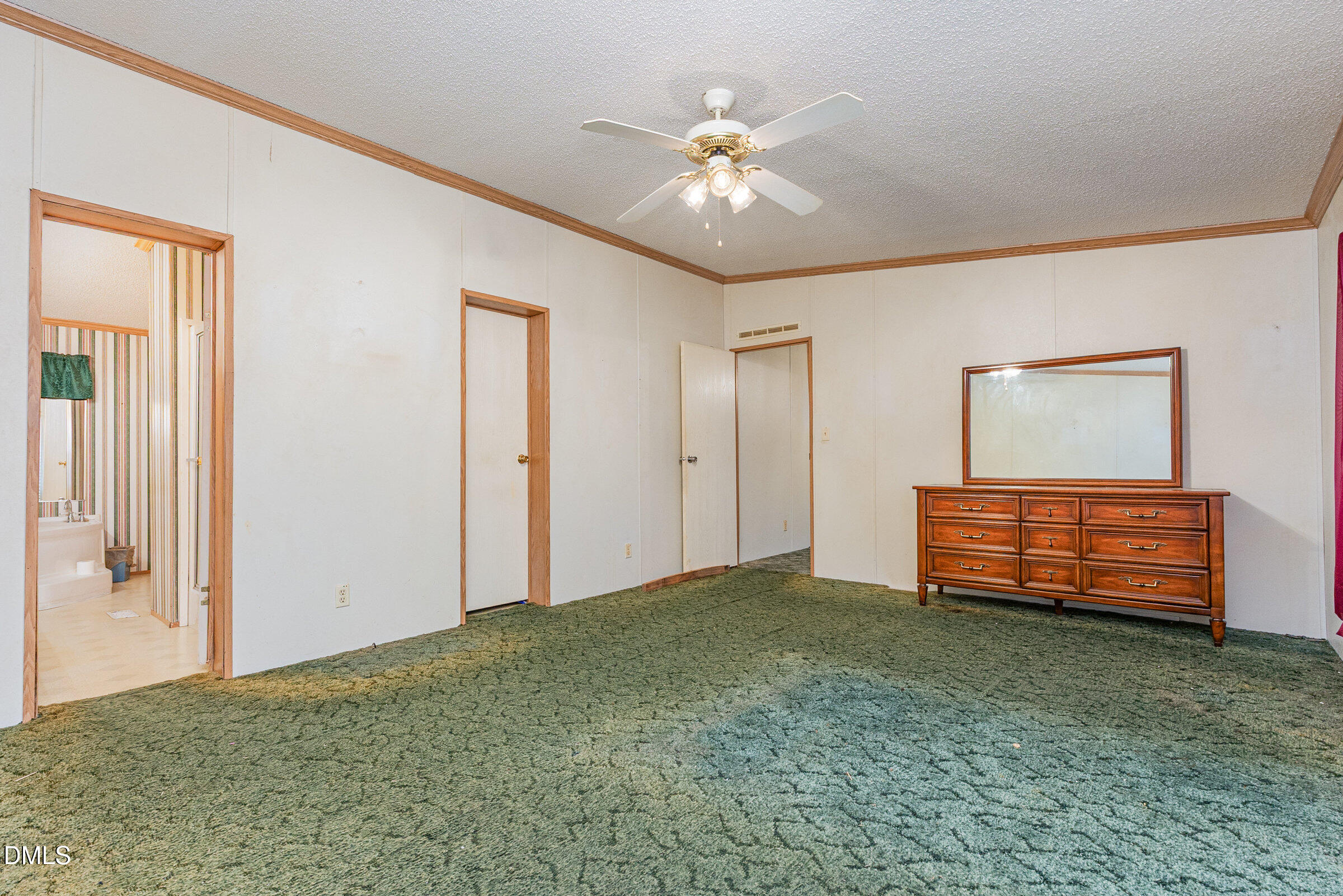 7472 Edwards Road Castalia, NC 27816 - Photo 15 of 36 an empty room with windows and ceiling fan