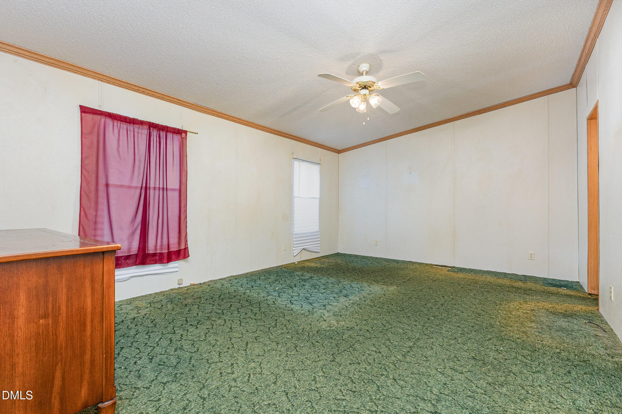 7472 Edwards Road Castalia, NC 27816 - Photo 22 of 36 a view of an empty room with window and chandelier fan