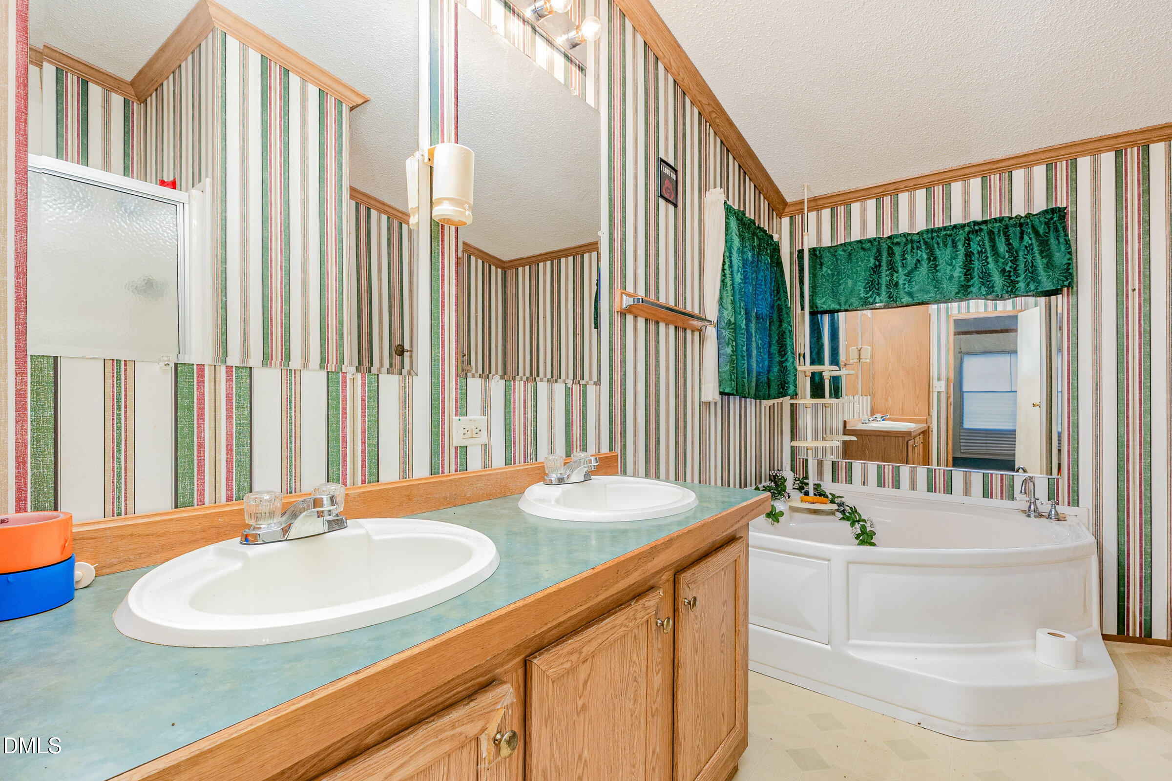 7472 Edwards Road Castalia, NC 27816 - Photo 24 of 36 a bathroom with a sink and a mirror