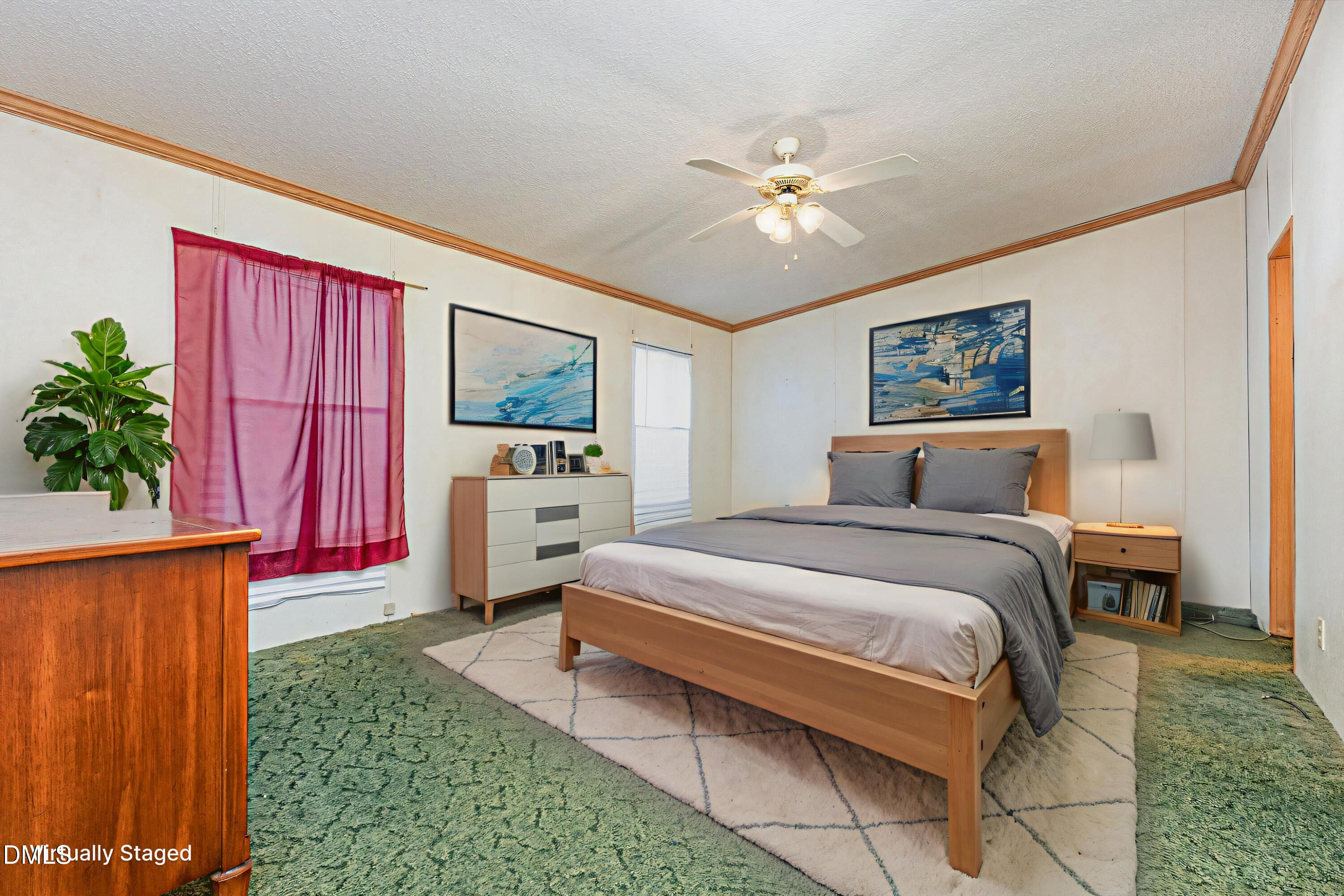 7472 Edwards Road Castalia, NC 27816 - Photo 3 of 36 a spacious bedroom with a bed and a chandelier
