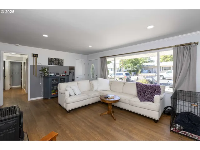 a living room with furniture flat screen tv and a fireplace