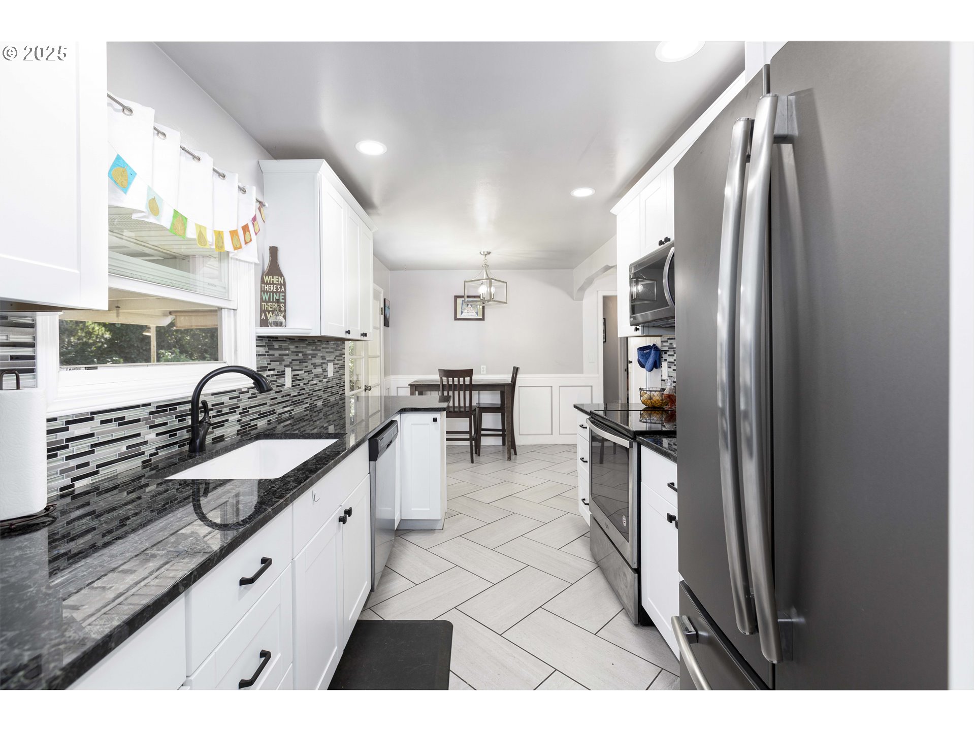811 Northeast Clyde Place, Unit 116C Grants Pass, OR 97526 - Photo 37 of 37 a kitchen with stainless steel appliances granite countertop a sink stove and refrigerator