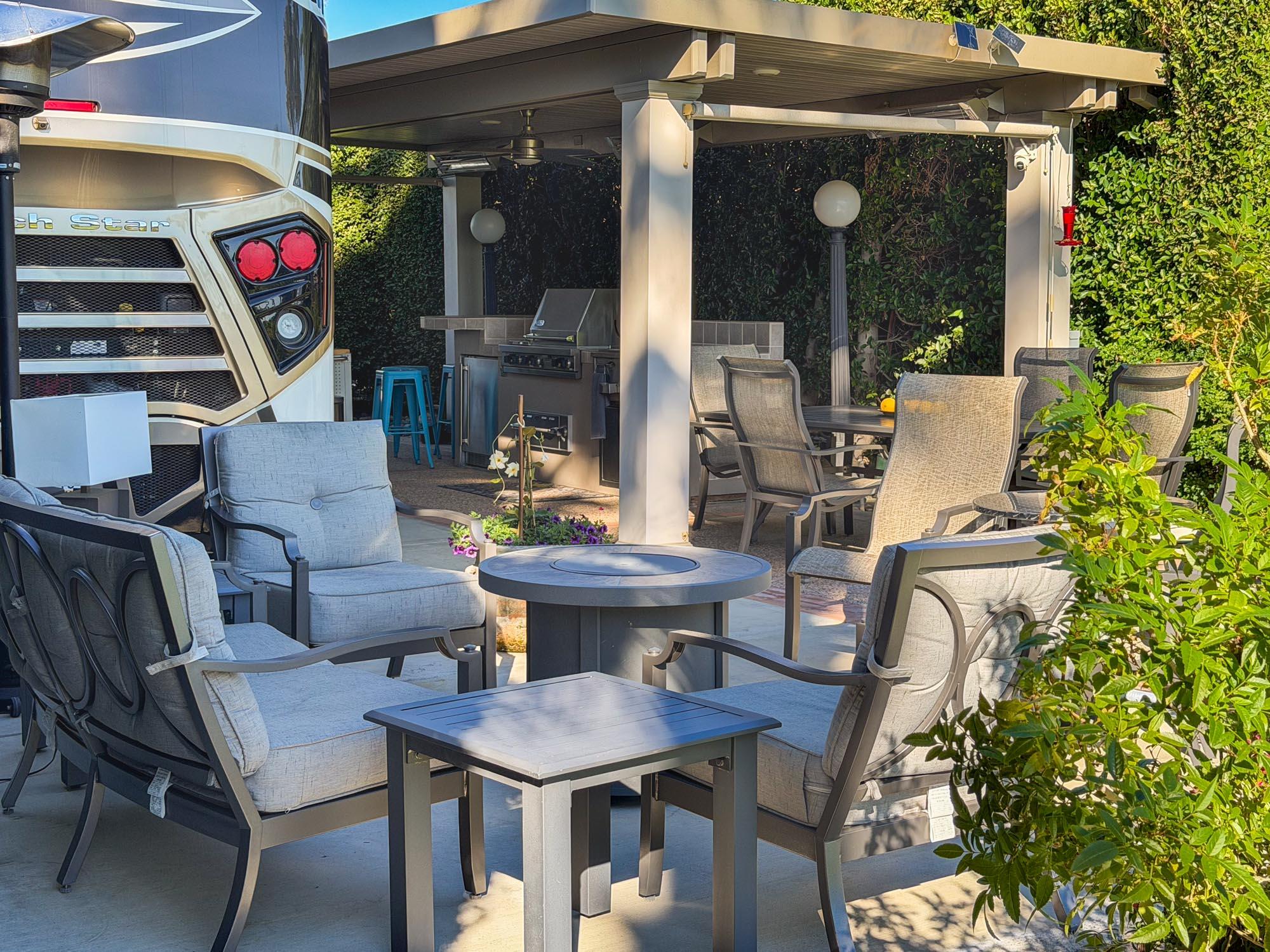 80394 Ave 48, Unit 220 Indio, CA 92201 - Photo 3 of 24 a view of a patio with dining table and chairs