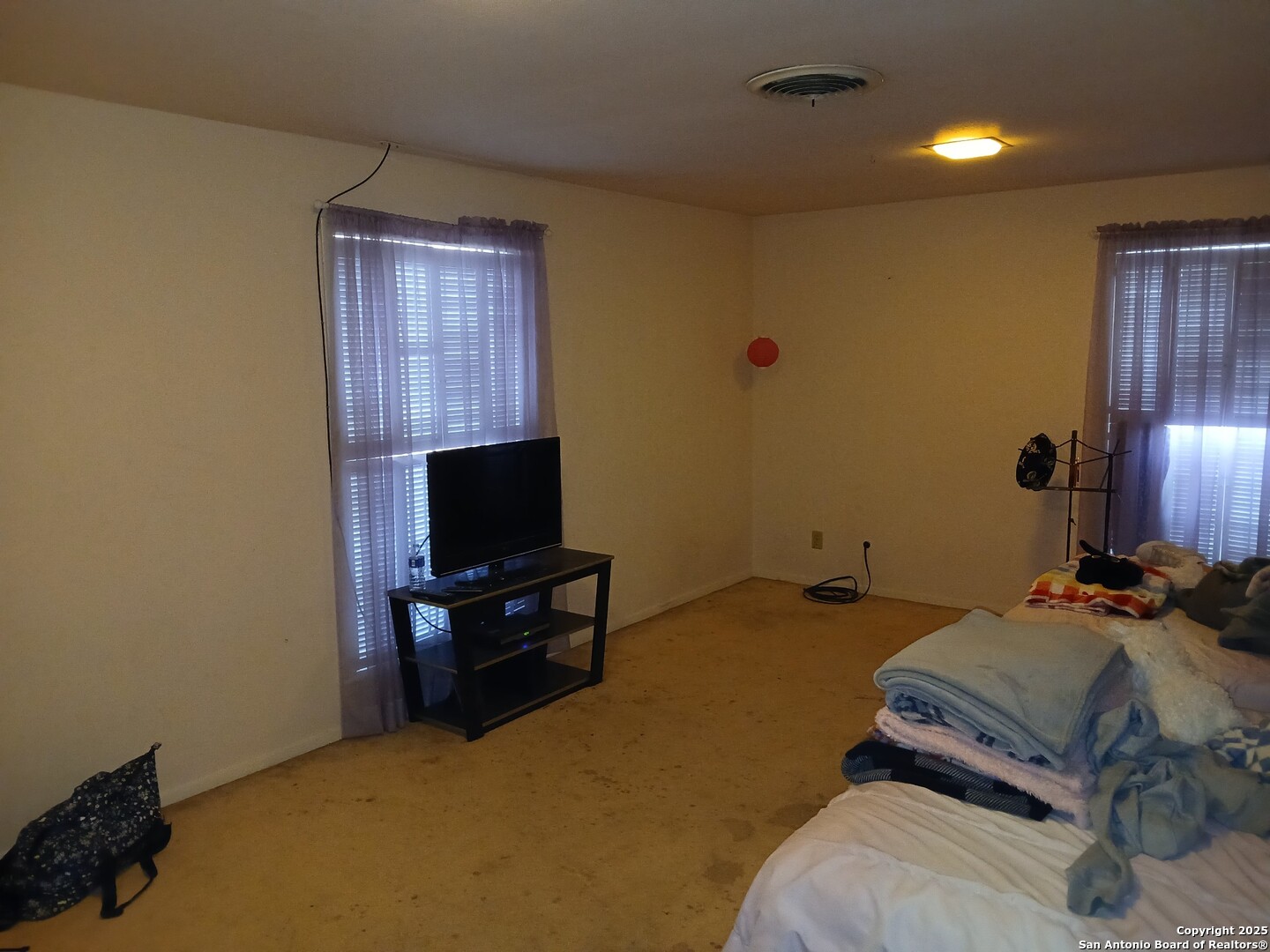 2916 Highway 44 Alice, TX 78332 - Photo 11 of 11 a bedroom with a bed and wooden floor