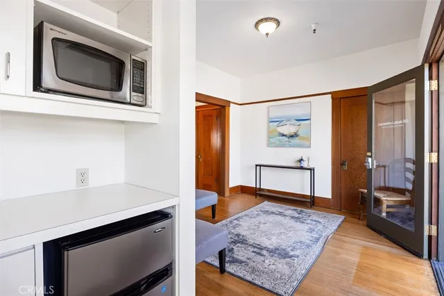 a front view of a house with a yard covered with snow