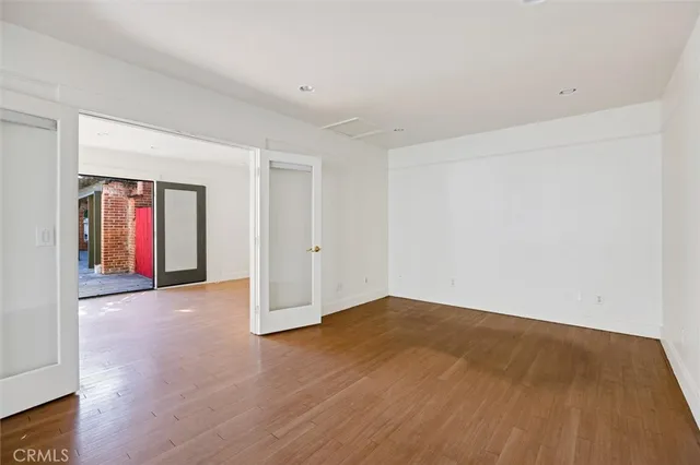 an aerial view of a house with a yard and large tree