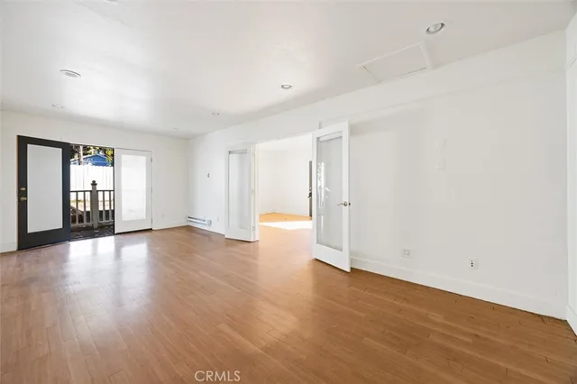 an aerial view of residential houses with city view