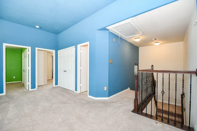 a view of a chair and table in the balcony