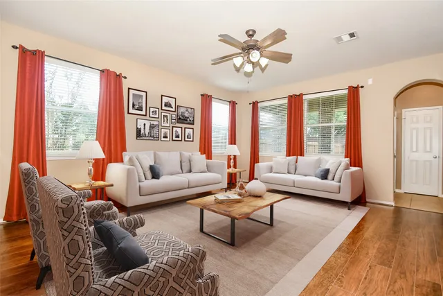 a living room with furniture and a large window