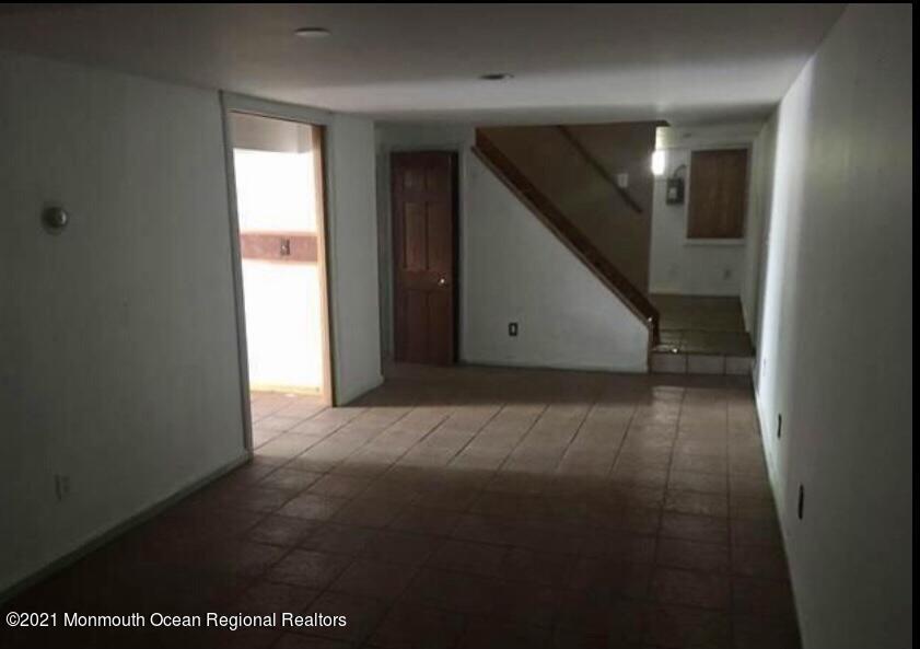1144 Aldrich Road Jackson, NJ 08527 - Photo 20 of 24 a view of an empty room with wooden floor