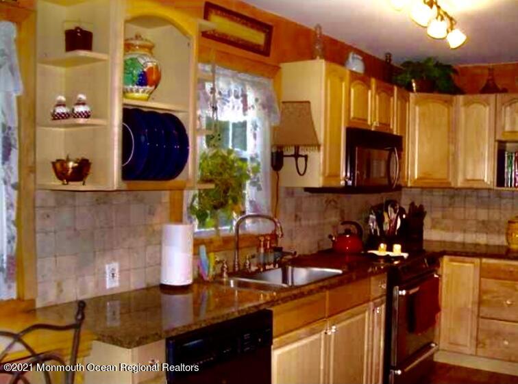 1144 Aldrich Road Jackson, NJ 08527 - Photo 10 of 24 a kitchen with a sink and cabinets