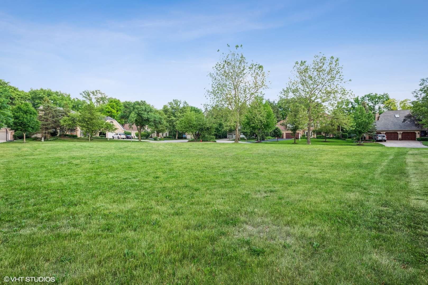 2908 Turnberry Road St. Charles, IL 60174 - Photo 6 of 10 a view of a grassy field with trees in the background