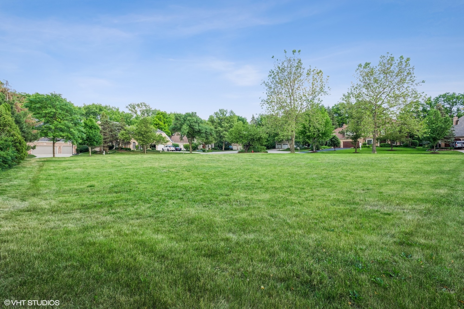 2908 Turnberry Road St. Charles, IL 60174 - Photo 7 of 10 a view of a grassy field with trees in the background