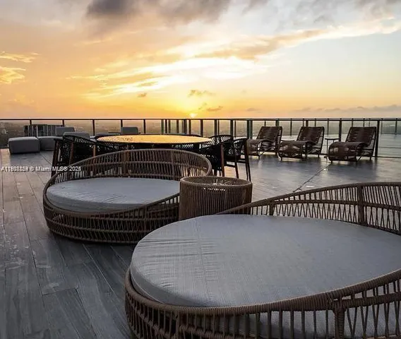 a terrace with outdoor seating and city view