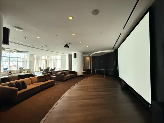 a living room with furniture window and flat screen tv