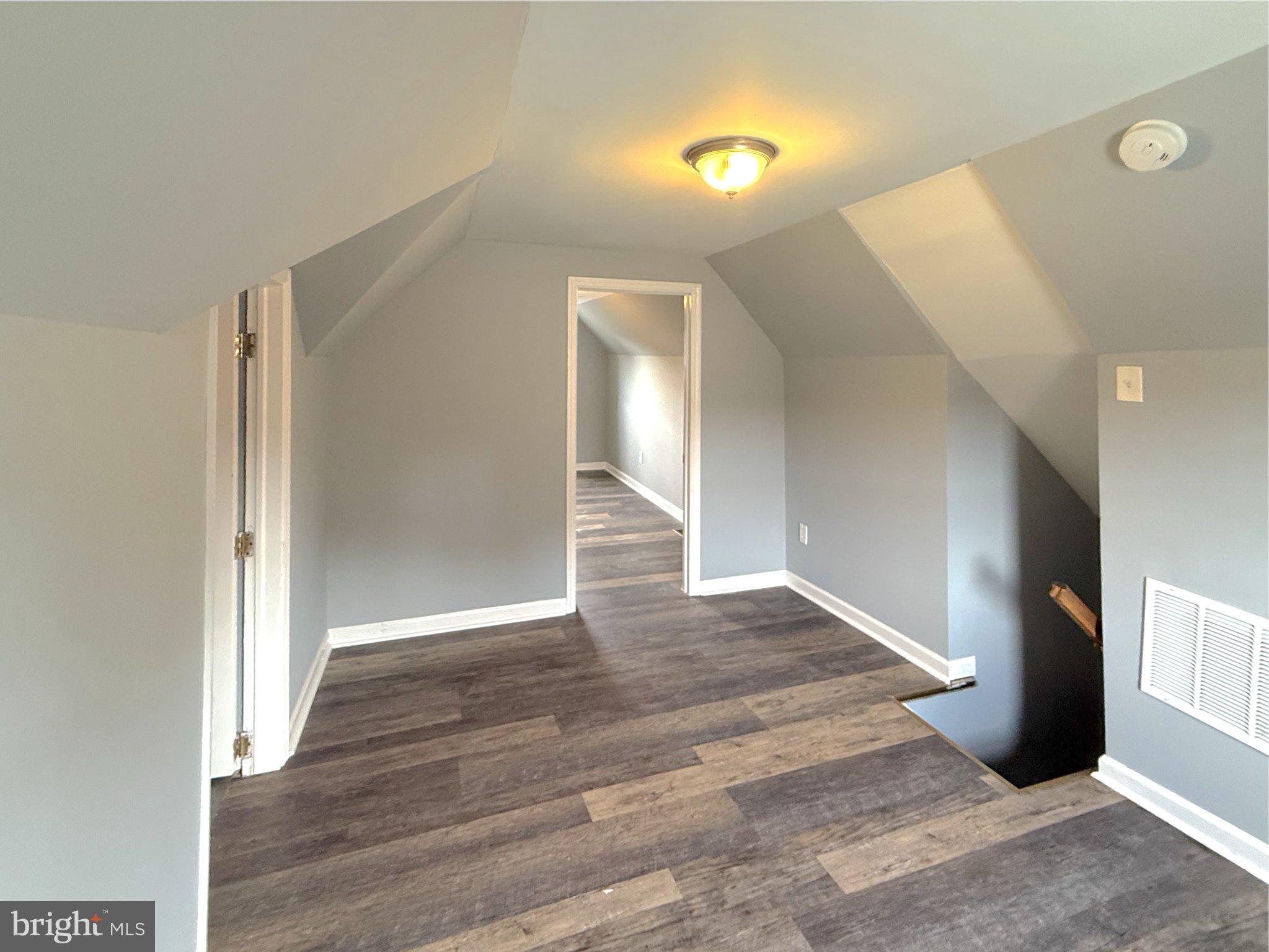 304 Collins Avenue, Unit 2 Baltimore, MD 21229 - Photo 11 of 17 Spacious attic retreat with modern charm.