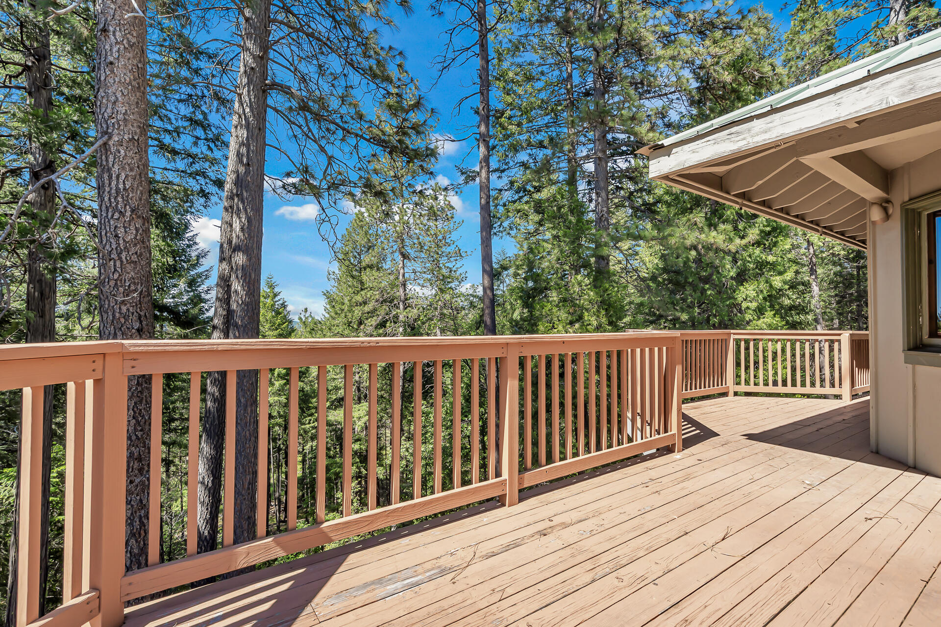 15368 Star Flower Road Oak Run, CA 96069 - Photo 11 of 63 a balcony with wooden floor and outdoor space