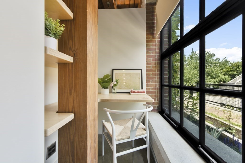 30 Howard Street, Unit 1 Somerville, MA 02144 - Photo 16 of 32 a view of a dining room with furniture and a window