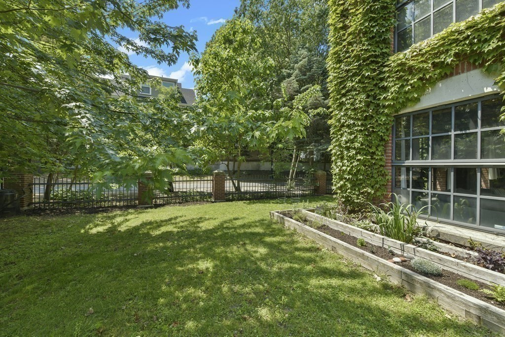 30 Howard Street, Unit 1 Somerville, MA 02144 - Photo 31 of 32 a view of a backyard with sitting area