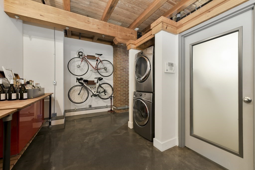 30 Howard Street, Unit 1 Somerville, MA 02144 - Photo 7 of 32 a view of a storage & utility room with washer and dryer