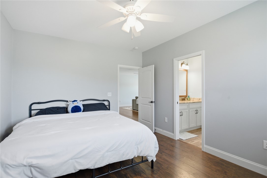 426 Oak Creek Road Seneca, SC 29678 - Photo 23 of 50 This cozy bedroom features durable hardwood flooring and a refreshing ceiling fan.