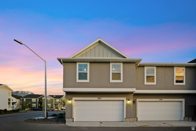 1223 East 1775 North Payson, UT 84651 - Photo 3 of 45 Modern townhome exterior featuring a neutral stucco finish and white trim