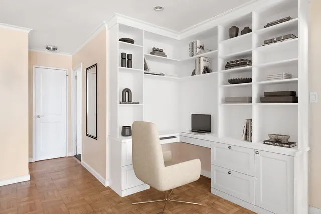 a view of living room with furniture cabinets and a window