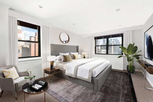 a bedroom with a bed furniture and a window