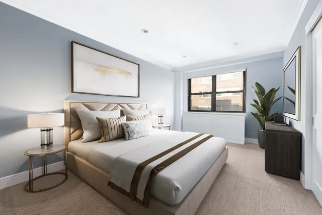 a bedroom with bed and window