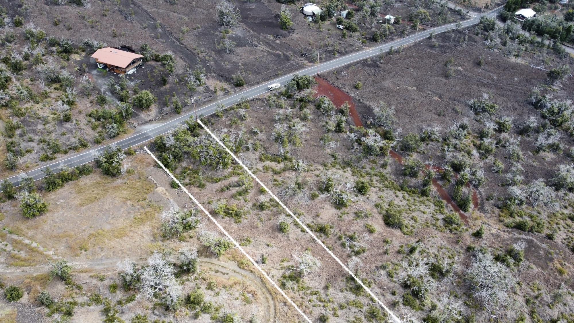 16 Koa Lane Ocean View, HI 96704 - Photo 2 of 14 a view of a dry yard with large trees