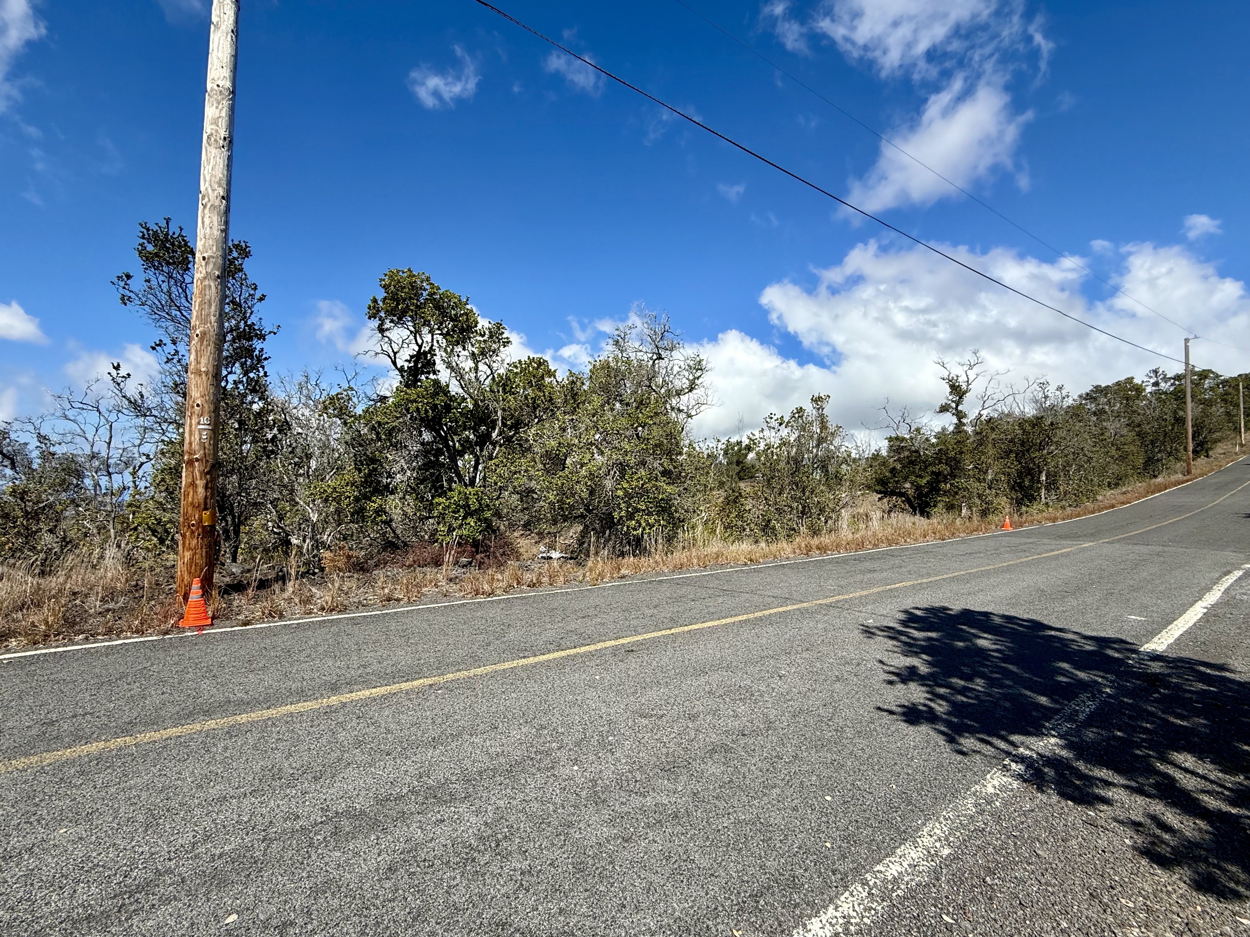 16 Koa Lane Ocean View, HI 96704 - Photo 3 of 14 a view of a road with a building in the background