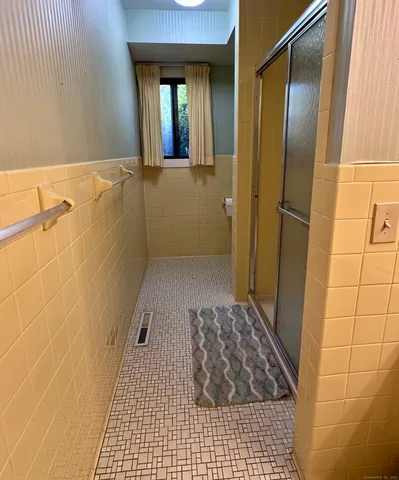 a bathroom with a sink and a shower