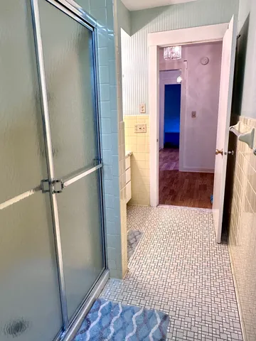 a view of an empty room and a window