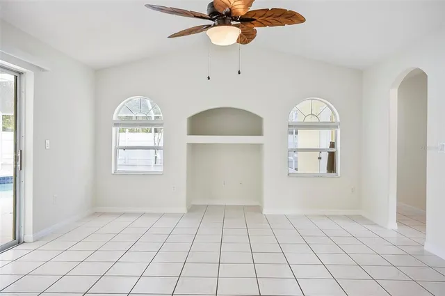 a view of a kitchen with a sink and a large window