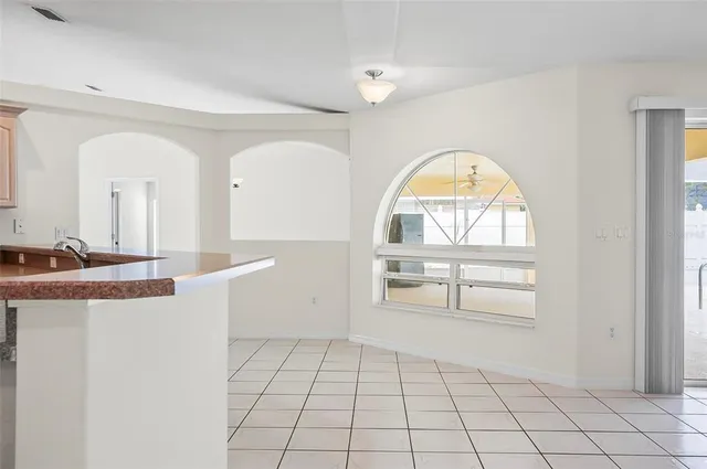 a bathroom with double vanity sinks and a mirror