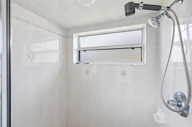 a bathroom with a sink toilet and mirror