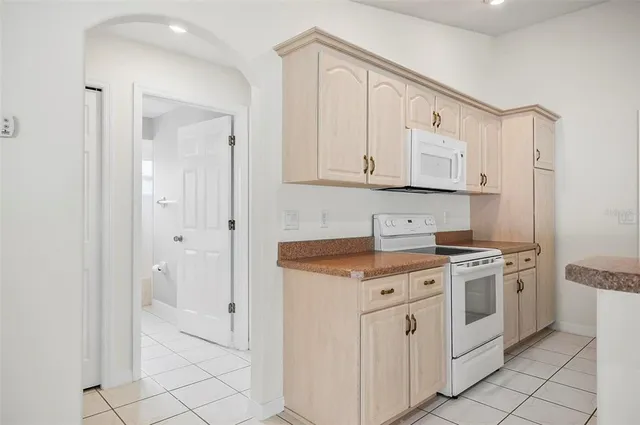 a view of a bathroom with a sink and mirror